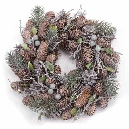 A beautiful natural inspired round wreath covered with Woodland foliage and assorted pinecones and berries 