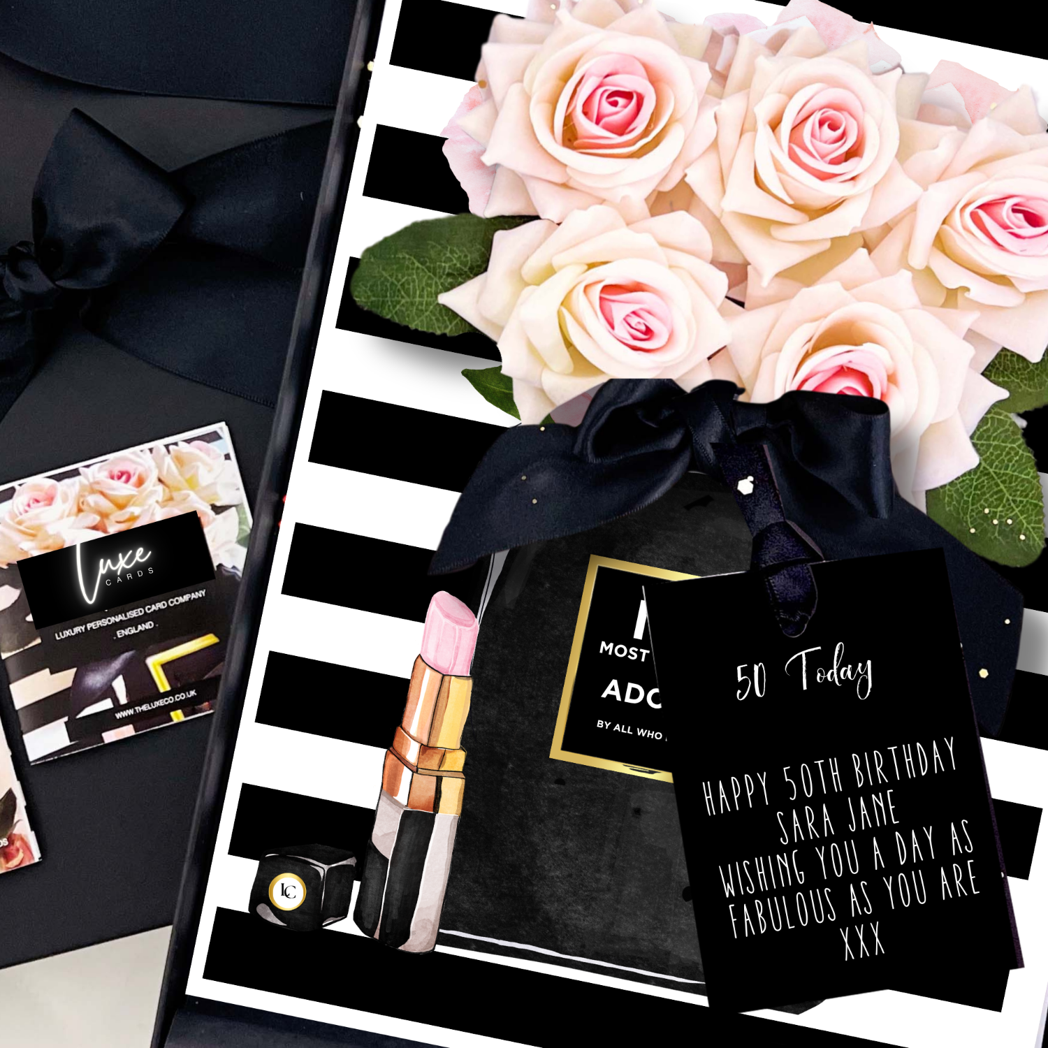 50th Card with lipstick, flowers, and personalized card on a black and white striped background