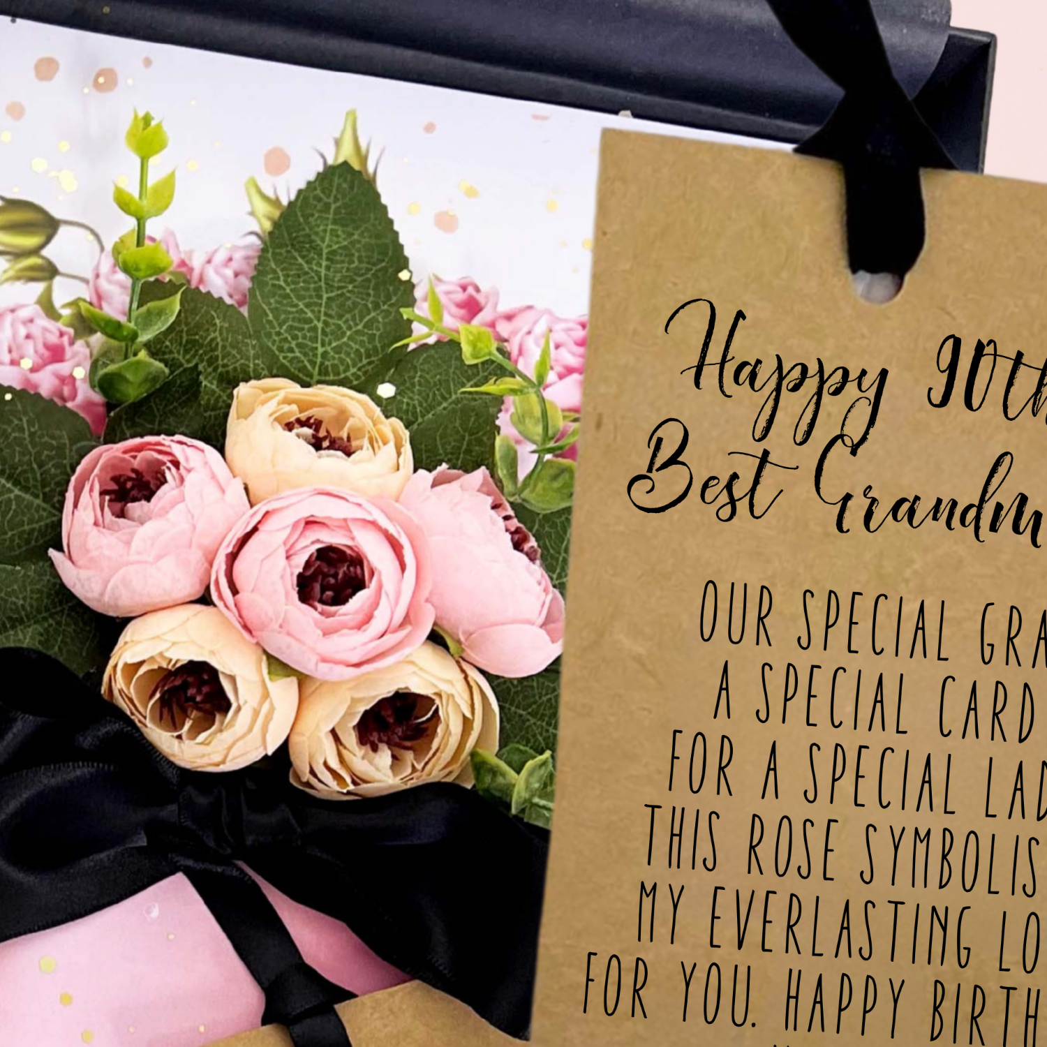 Bouquet of flowers with a gift box and 'Happy 90th Best Grandma' card.