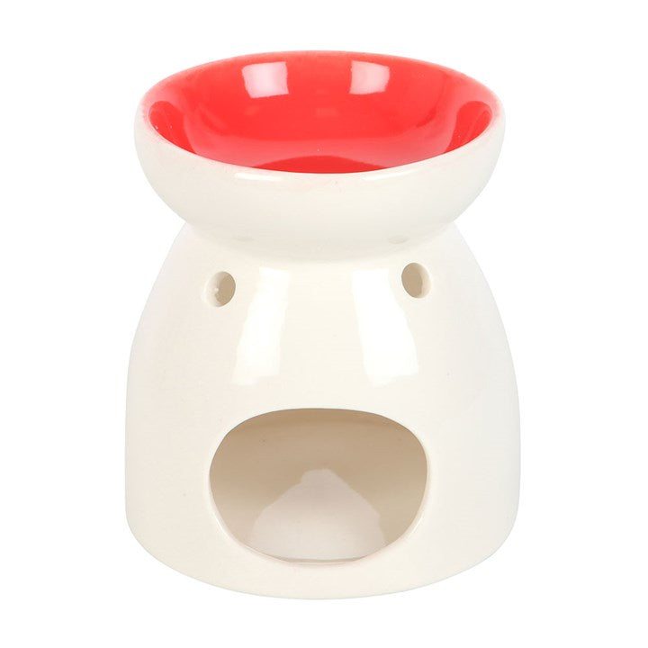 White ceramic oil burner with a red top on a white background