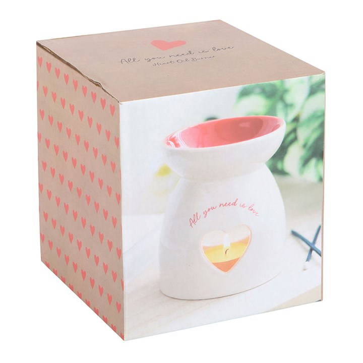 White heart oil burner in a decorative box featuring heart patterns and text reading All you need is love