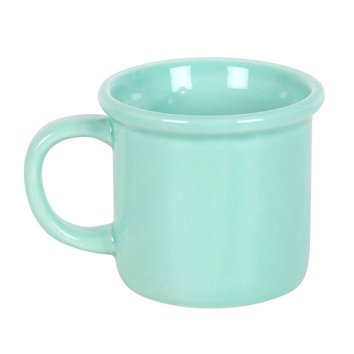 Turquoise mug on a white background