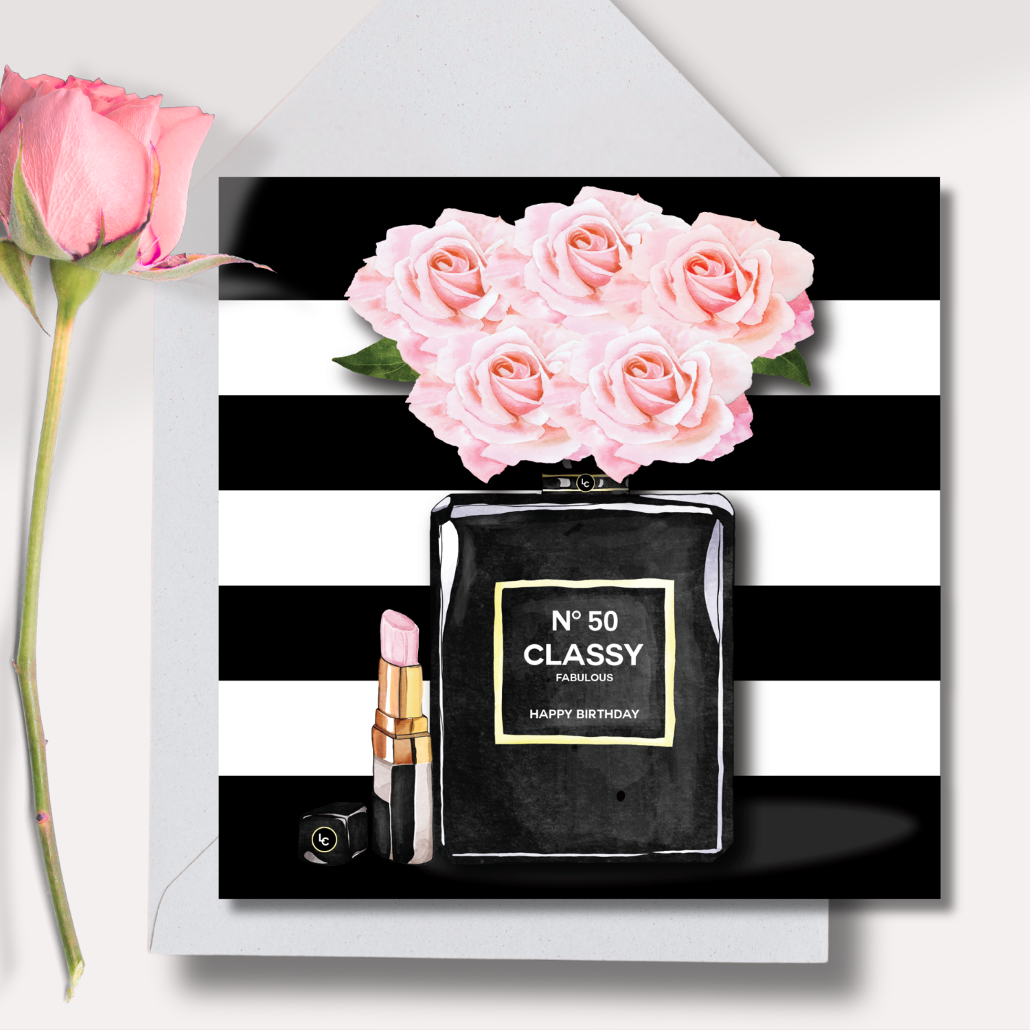 50th Birthday Black perfume bottle card with pink roses and lipstick on a black and white striped background