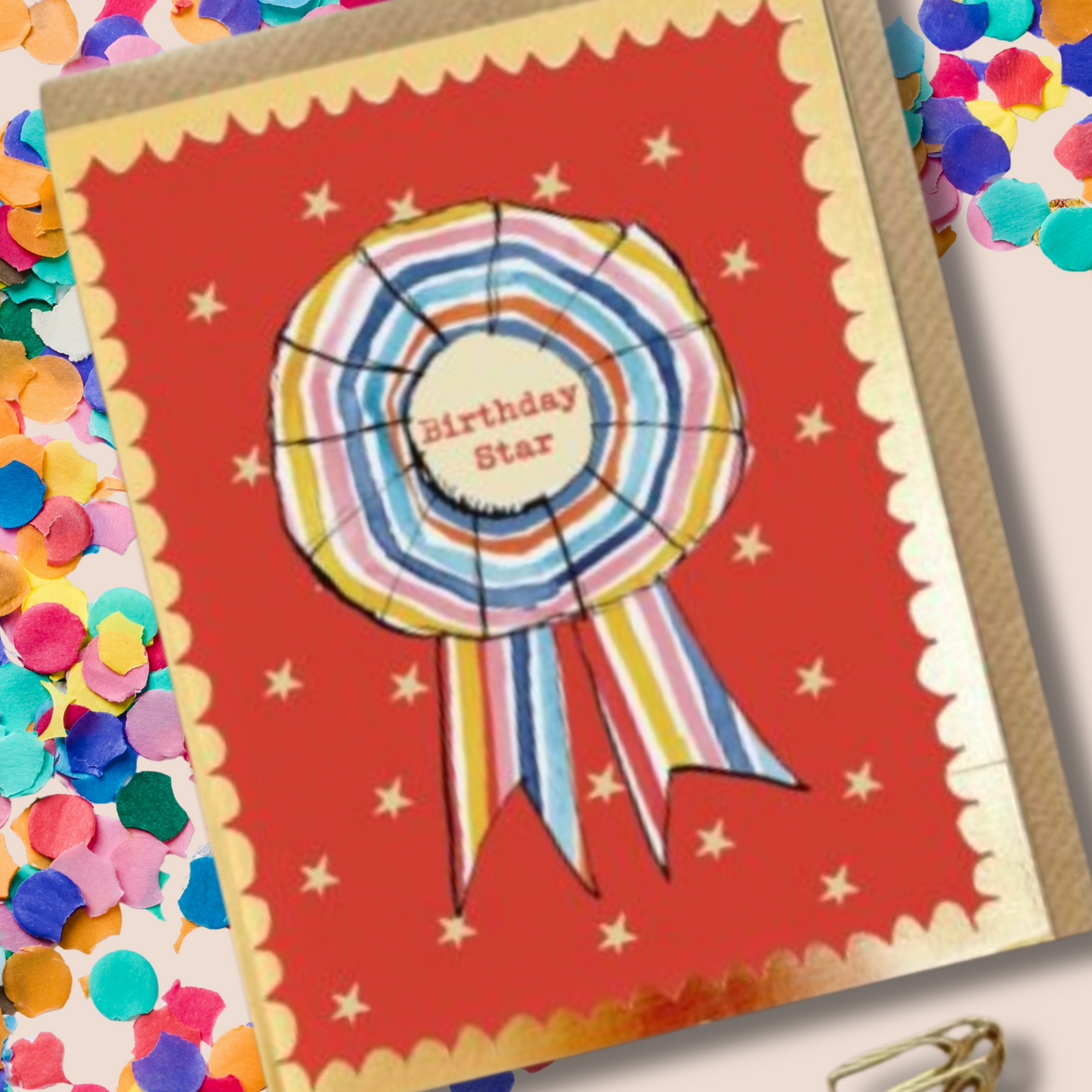 Rosette Birthday Star Card Greeting card with a colorful ribbon design and 'Birthday Star' text on a red background.
