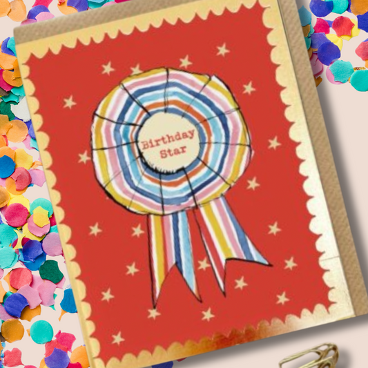 Rosette Birthday Star Card Greeting card with a colorful ribbon design and 'Birthday Star' text on a red background.