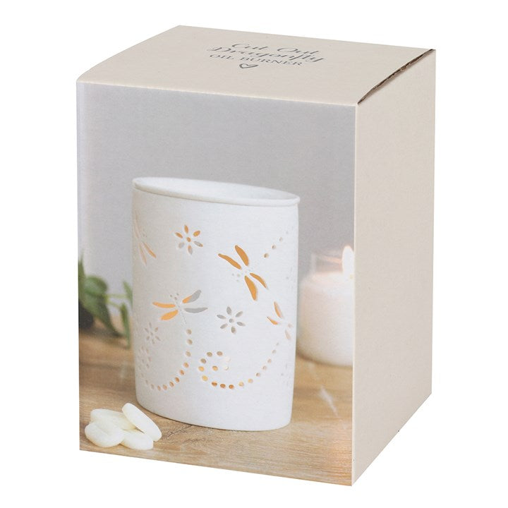 Boxed White dragonfly wax warmer with floral designs in a decorative box on a white background