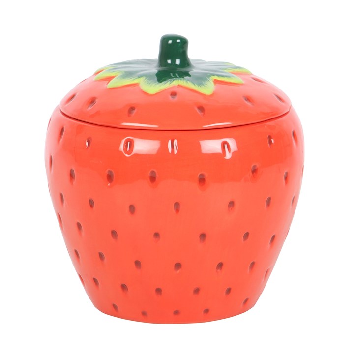 Strawberry-shaped oil burner jar with a green lid on a white background