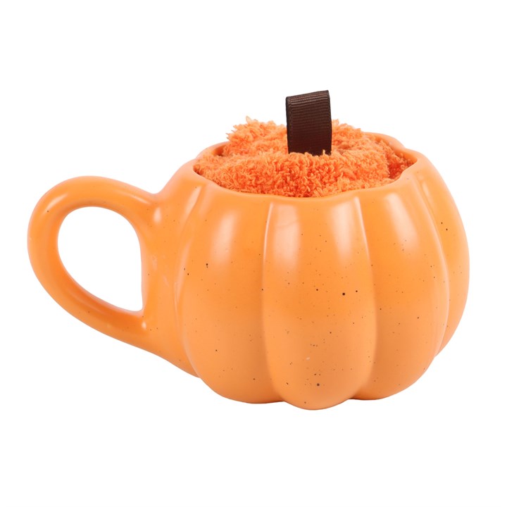 Pumpkin-shaped mug with a fluffy interior on a white background