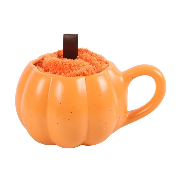Pumpkin-shaped mug with a fluffy orange interior on a white background