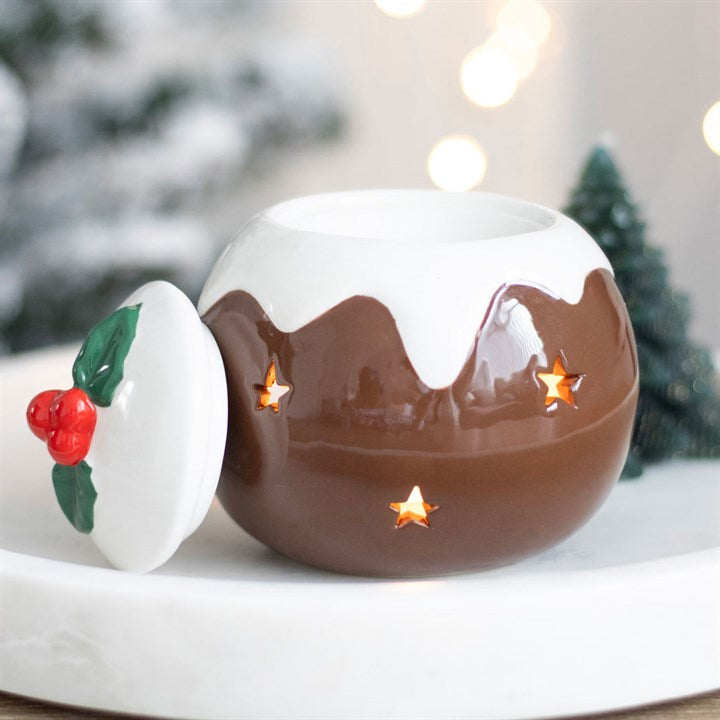 Christmas Pudding Tealight Holder oil fragrance burner warmer Christmas tree and holly design, set against a blurred festive background.