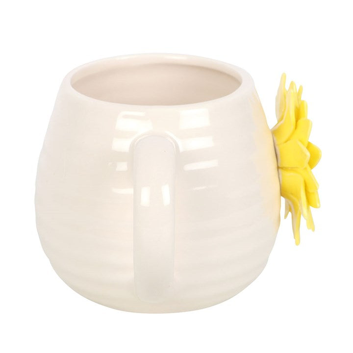 White ceramic sun flower mug with a yellow sunflower design on a white background