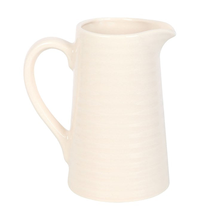 White ceramic pitcher on a white background