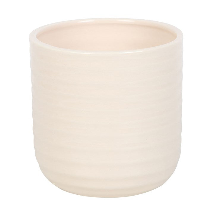 Beige ceramic plant pot on a white background