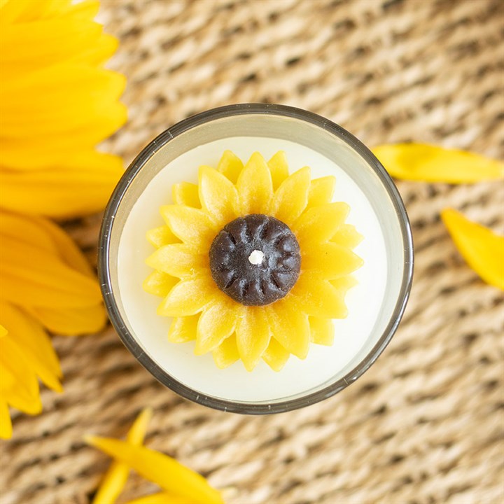 3rd Anniversary Candle Gift with sunflower design on a woven surface