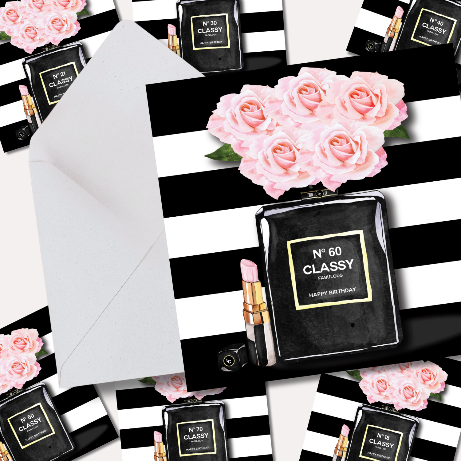 Black perfume bottle with pink roses and a white envelope on a black and white striped background