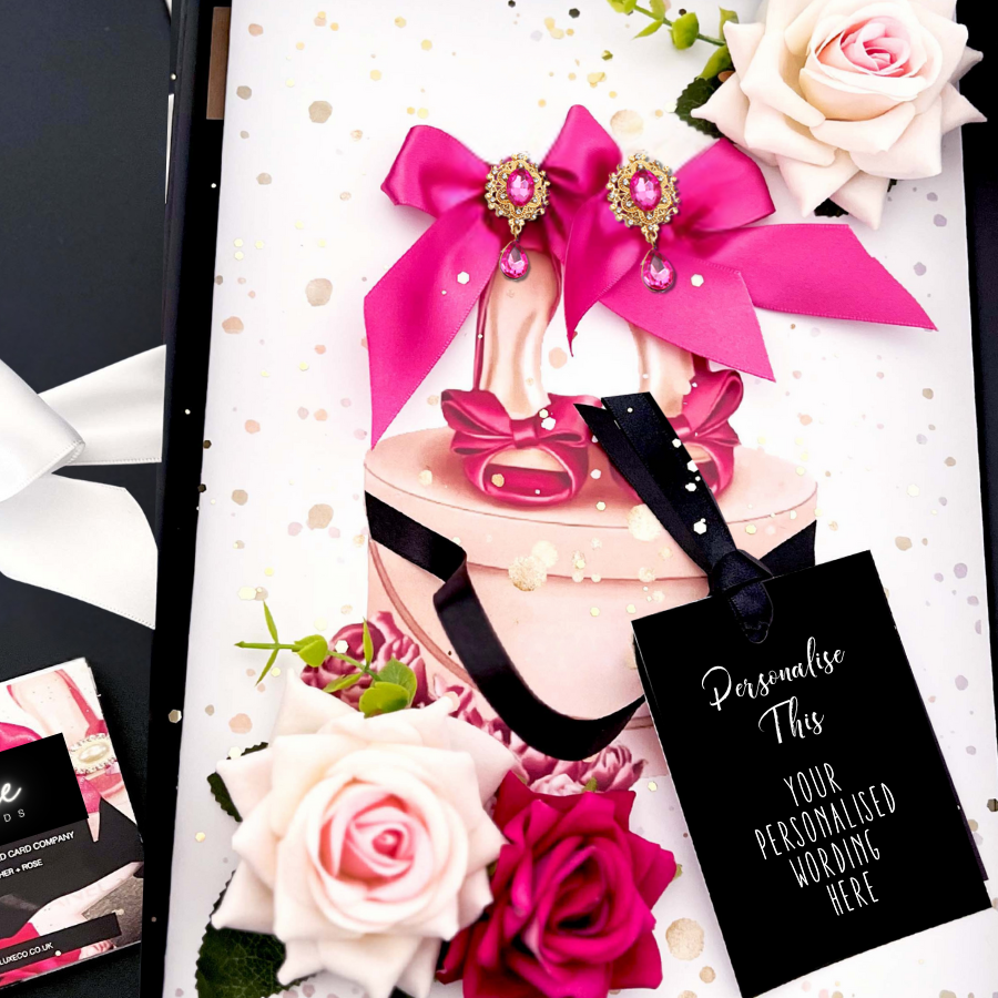 Luxury Personalised Pink high-heeled shoe Card handmade with decorative bows, crystals, surrounded by scented handmade everlasting roses and flowers and a black tag for your personalization. Luxury Handmade Personalised Cards for Special Occasions by Luxe Cards