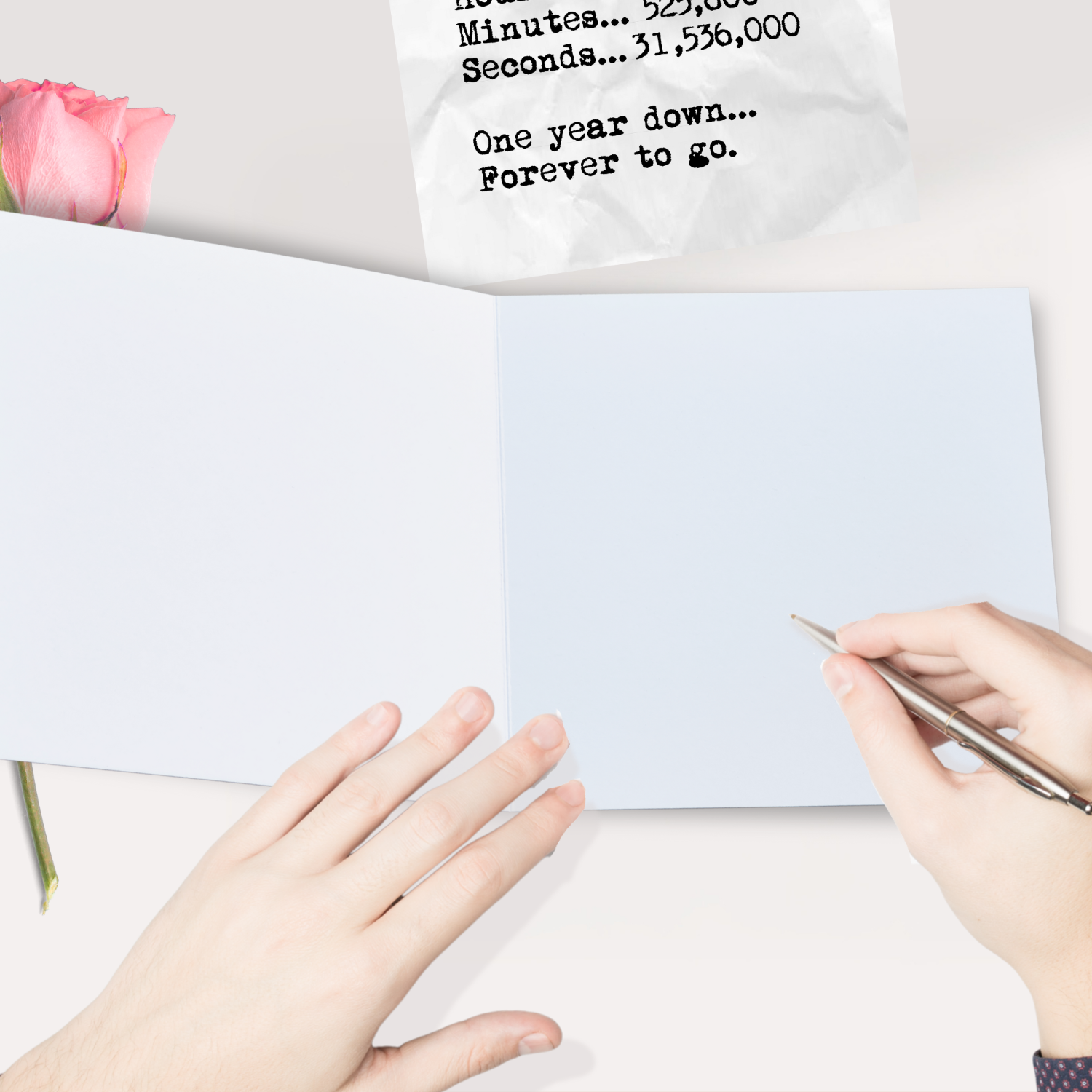 365 Days 1st First Typewriter Anniversary Card Person writing on a piece of paper with a pink flower and a white card in the background.