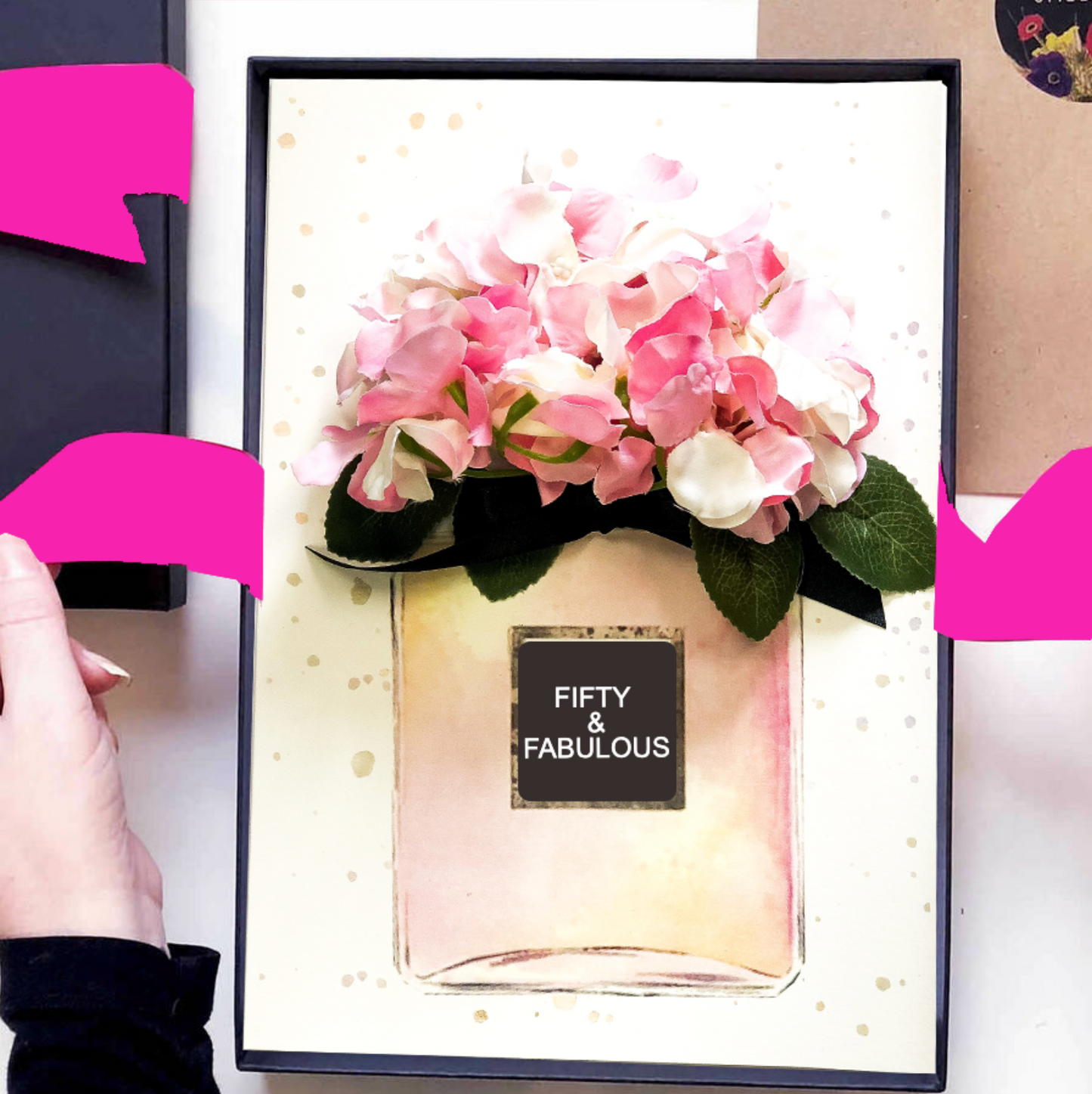 Fifty and Fabulous Luxury 50th birthday cards | The Luxe Co | Pink perfume bottle filled with hydrangea's scented and tied with hot pink satin ribbon bow