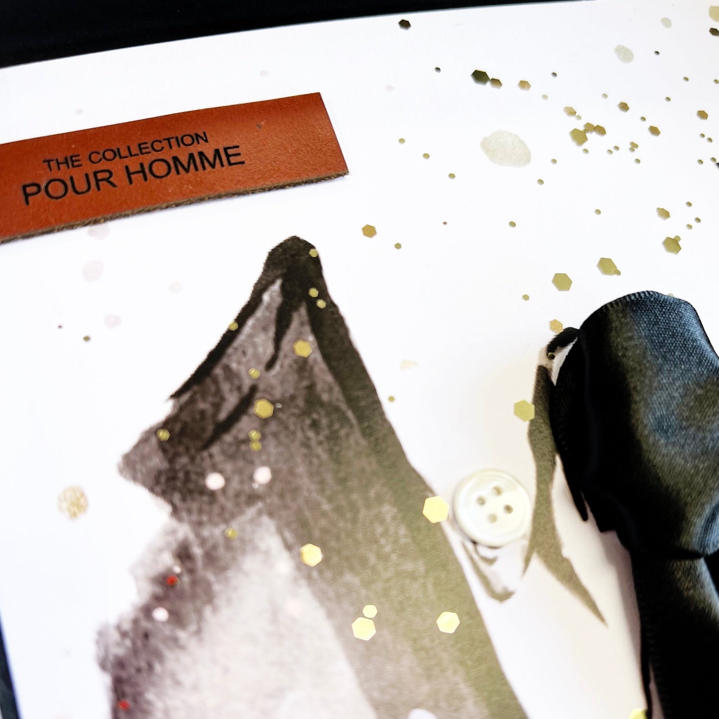 Pour Homme Tan Leather tag on each mans card