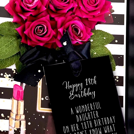 Hot Pink Bouquet of pink roses Luxury 18th Birthday card with a black gift bag and pink lipstick on a decorative background.