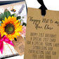 Momma Bloom Wildflower Niece 21st Birthday Card - A handmade Nieces birthday card with bright pink ribbons, a silk yellow sunflower, green leaves, and handbag flower display fragranced in 'Wildflower' to wow the recipient as soon as they open it
