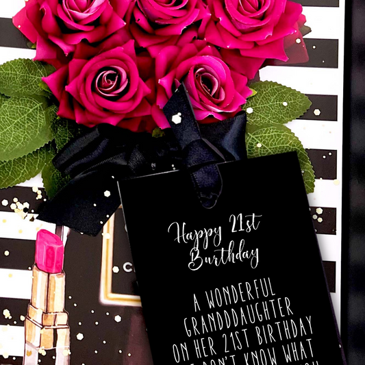 Granddaughter Bouquet of 21st Birthday pink roses Card with a black gift bag and pink lipstick on a decorative background.