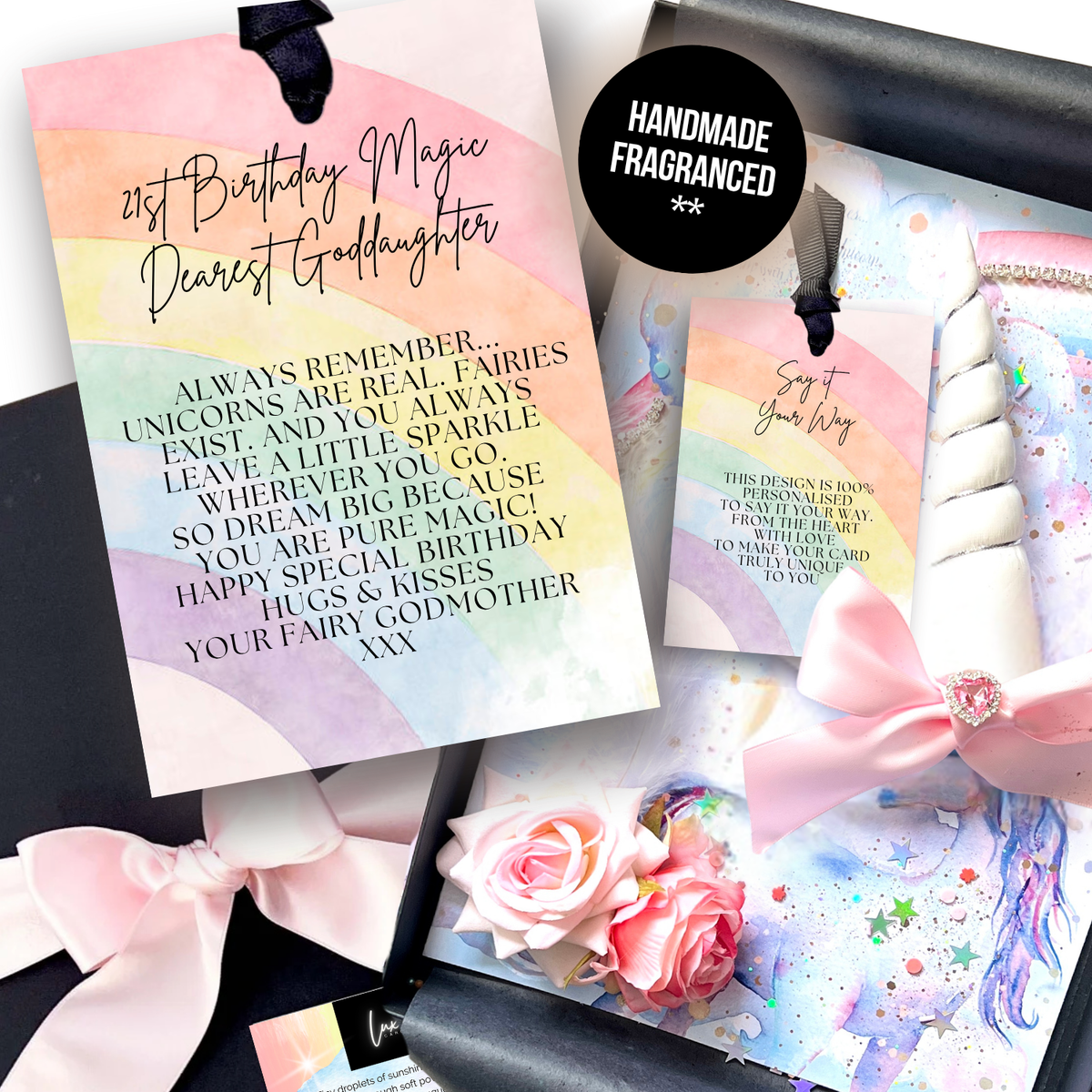 Handmade Personalised Magical 21st Unicorn birthday card personalized unicorn-themed birthday card set, featuring a large card reading  '21st Birthday Magic Dearest Granddaughter' with a pastel rainbow watercolor background, a smaller matching card, a wrapped white gift tied with a pink ribbon, and decorative flowers and black packaging on a white background.