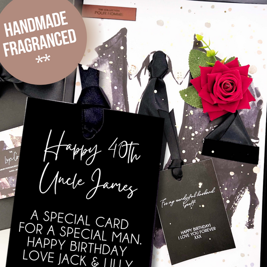 Luxury 'Happy 40th Uncle James' card with hand made red rose, and black bow on a white background.