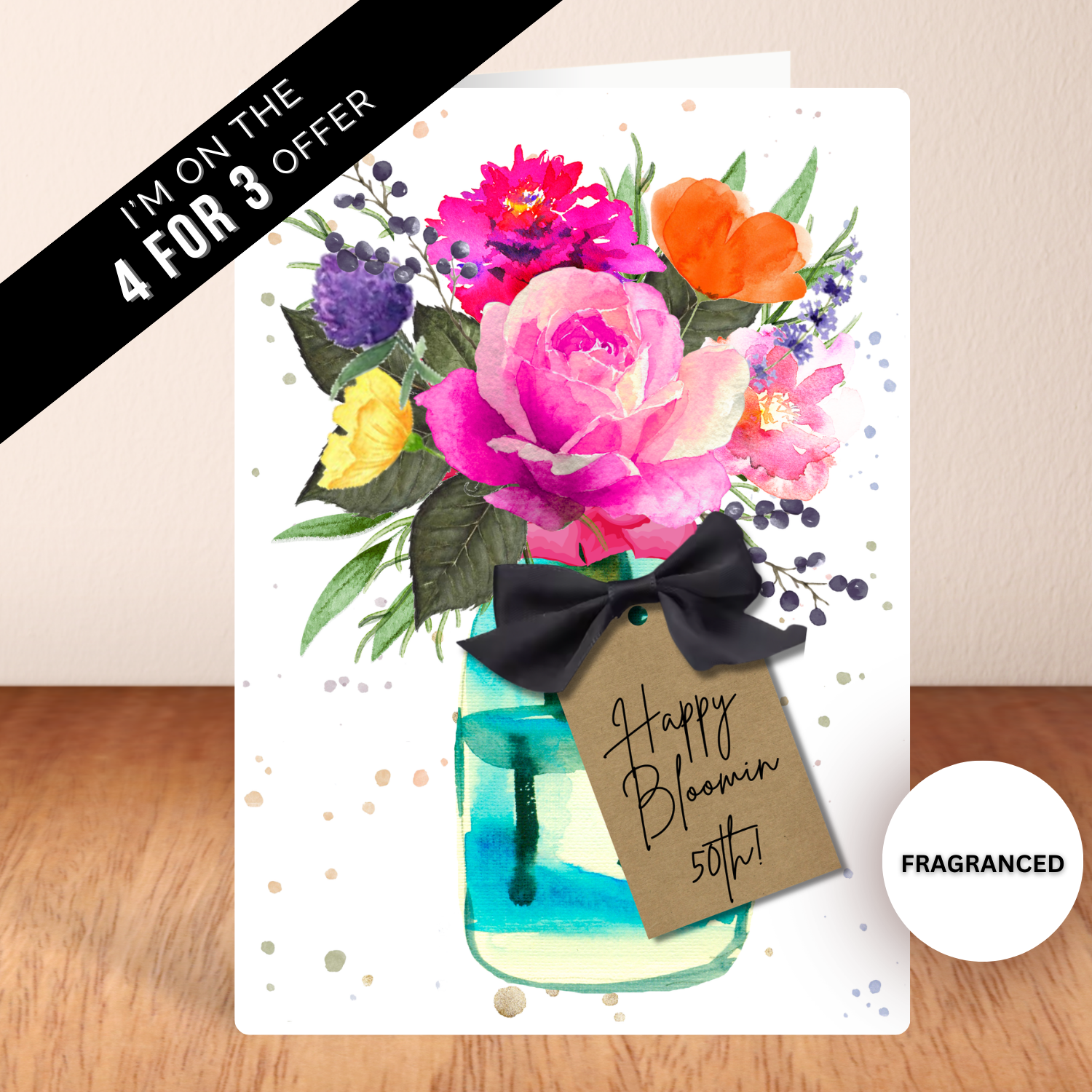 Happy Bloomin 50th Scented Hot Pink Rose Birthday Card with envelope on 350gsm white silk card, printed with artist drawn watercolour roses in vase, handmade with black silky satin bow, fragranced in English Rose for a 50th Birthday Card that's an experience. A5 scented cards are supplied with recycled kraft envelope suitable for large letter posting and comes individually wrapped in  in compostable cello to keep fragrance fresh for when you use it. Take advantage of the 4 for 3 promotion to never miss 
