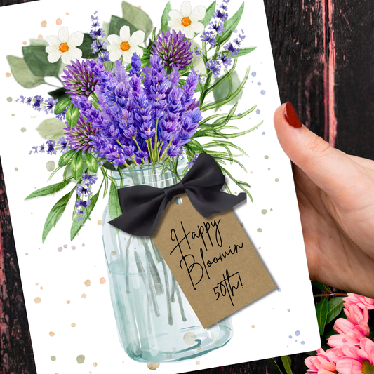 Happy Bloomin 50th Lavender Scented A5 Birthday Card with envelope - A handmade Greeting card with lavender flowers, a black bow, and 'Happy Bloomin' 50th!' printed.