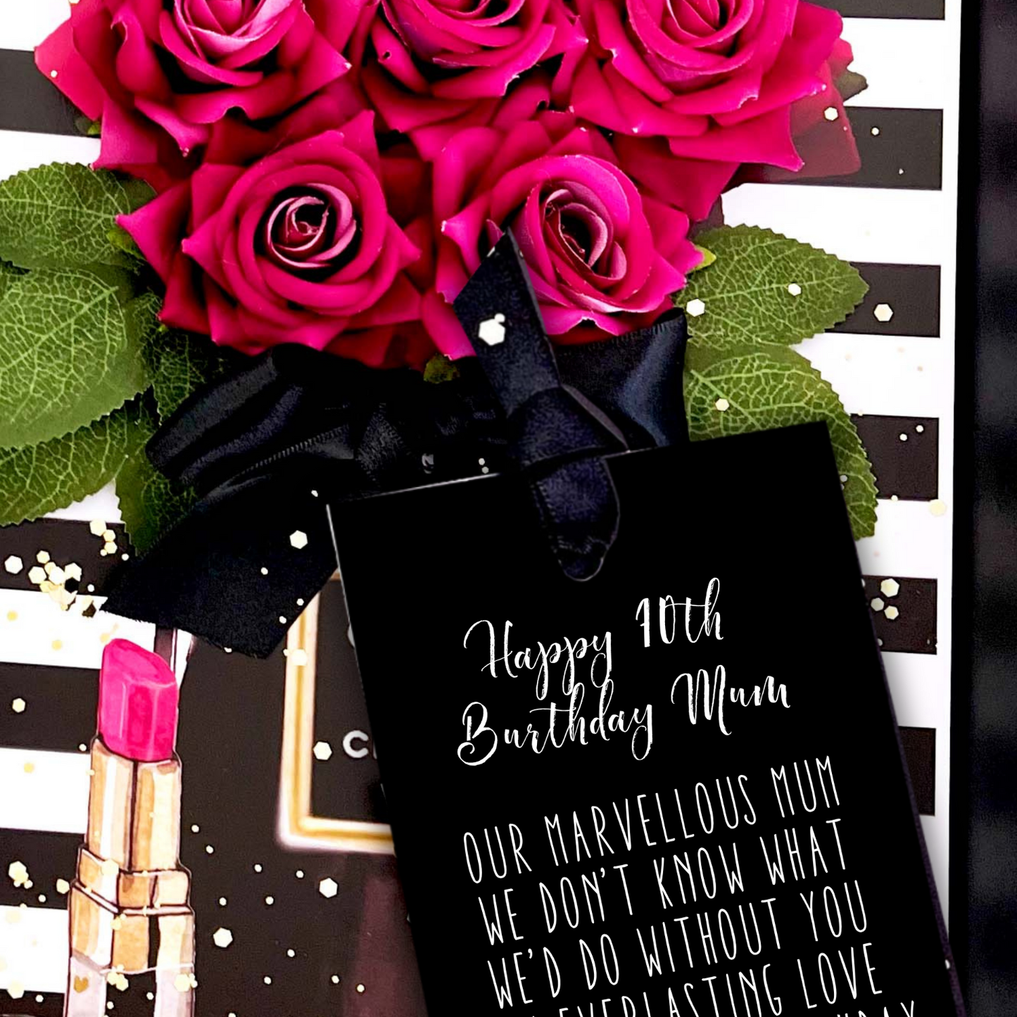 70th Mum Bouquet of pink roses with a black card and pink lipstick on a decorative background
