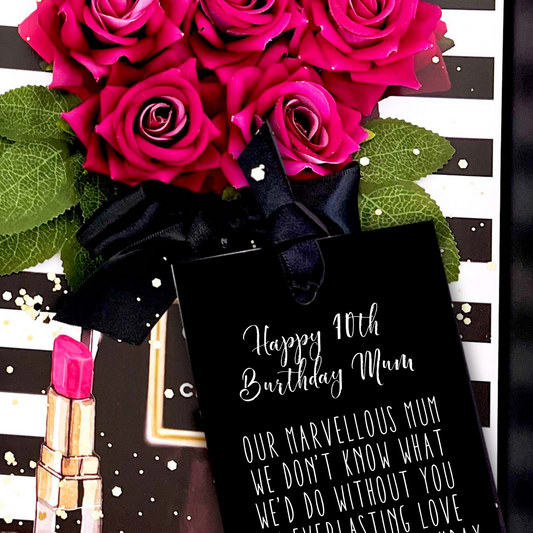 70th Mum Bouquet of pink roses with a black card and pink lipstick on a decorative background