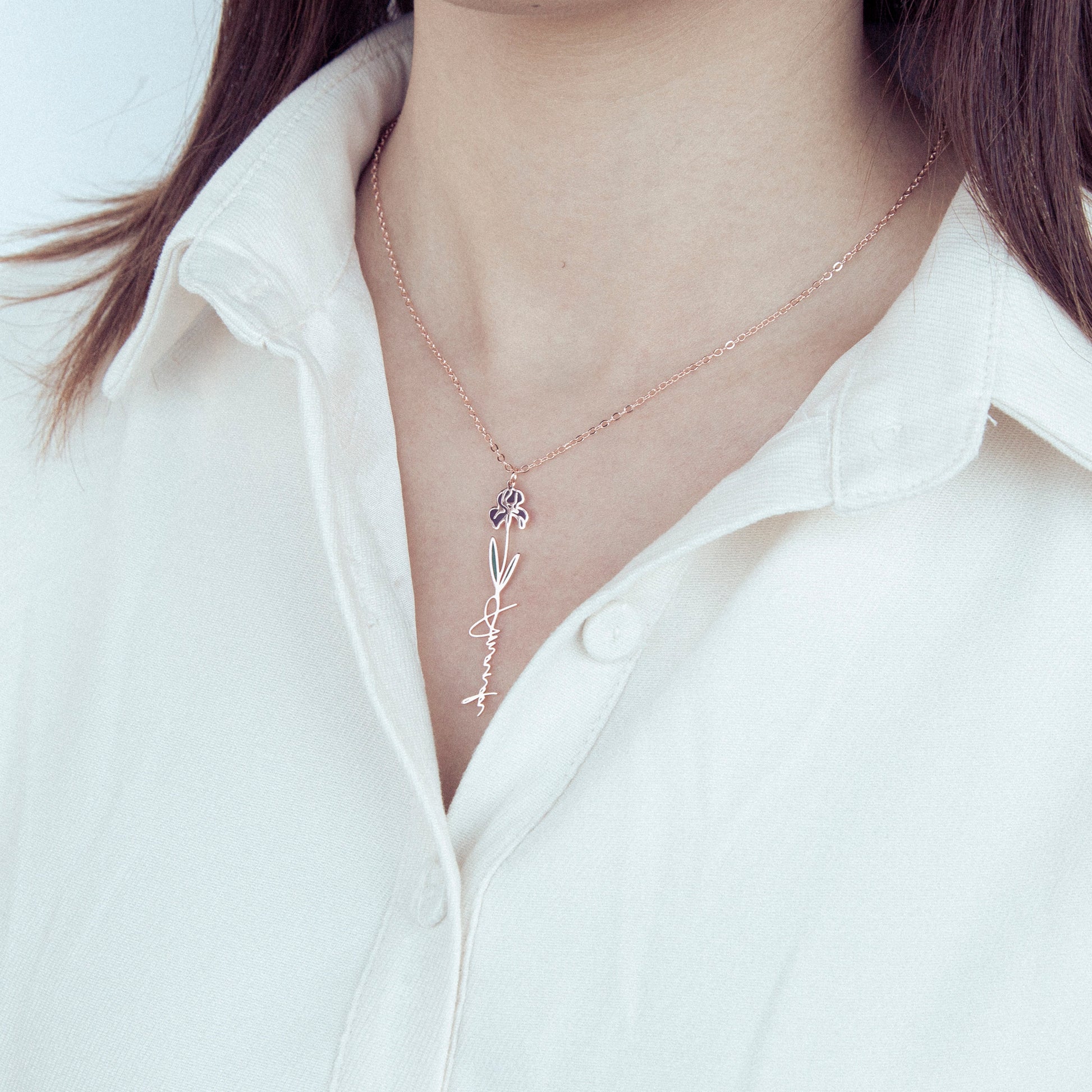 Birthday Birth Flower Necklace with a delicate design worn by a person against a white background