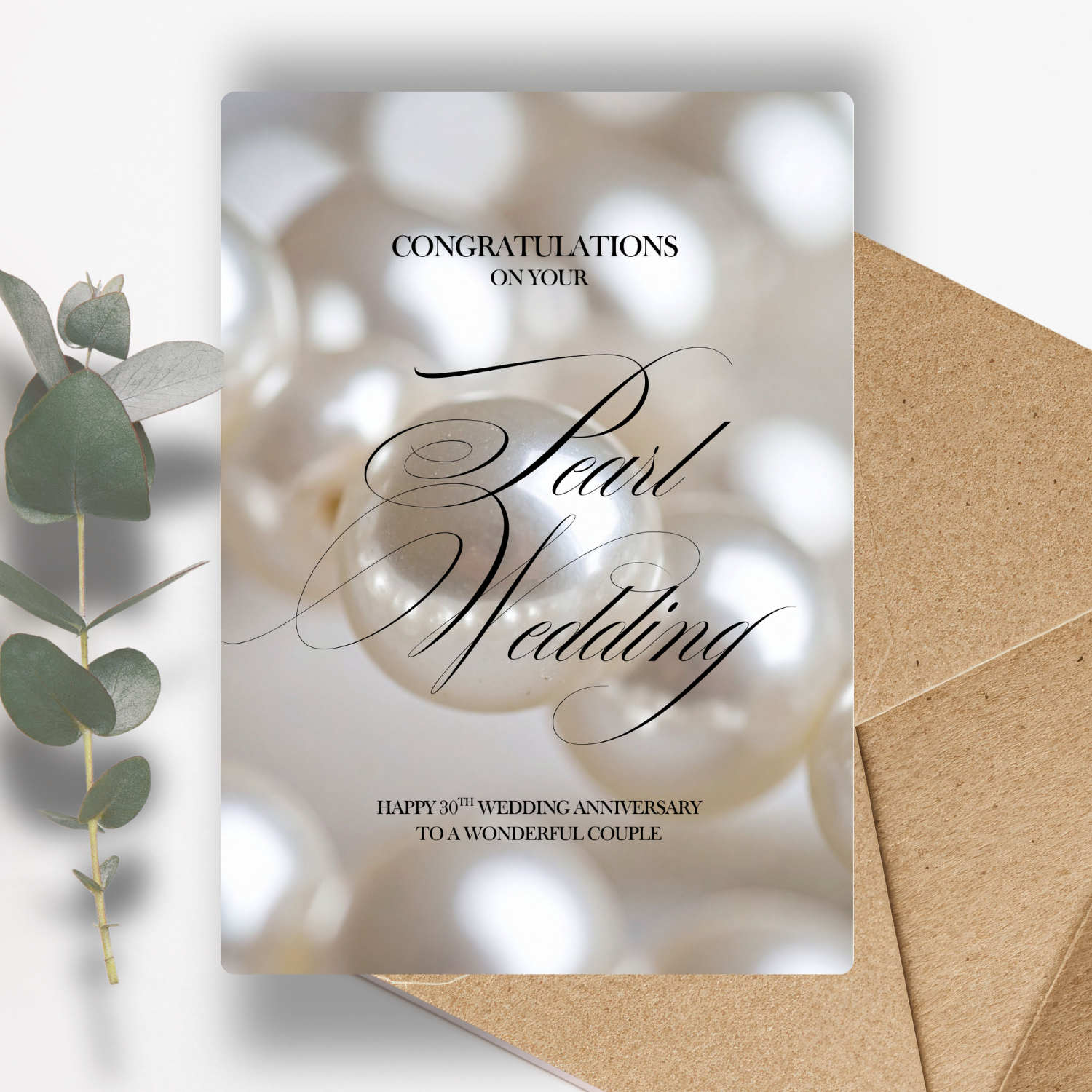 Congratulations on your Pearl Wedding Happy 30th Wedding Anniversary To a Wonderful Couple Pearl wedding anniversary card with a pearl and eucalyptus leaf on a white background