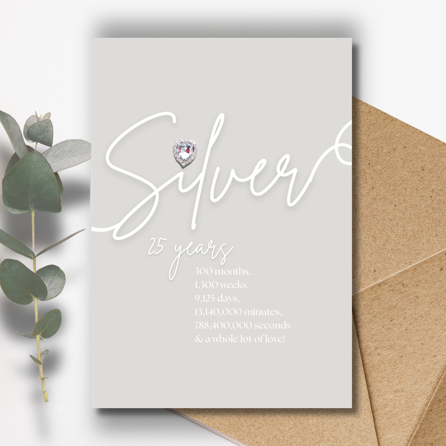Silver anniversary Greeting card with 'Silver 25 years' text and handmade with a diamond diamante silver heart, with a brown envelope.