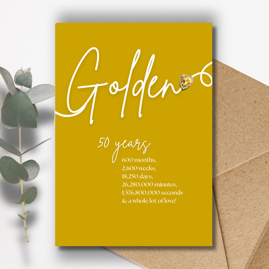 Handmade A5 Swirly Sparkly Diamante Golden Heart Anniversary Card Yellow card with 'Golden 50' text and an envelope on a white background