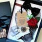 A luxury gift box handmade luxury personalised card for him presented on a velvet gift box. The set includes a black gift box with a black satin ribbon handmade with black bow tie, a gold-tone watch with a black dial, a everlasting red rose, and a 'Say Your Way' personalised printed wording card. Scented in masculine antique cologne for his birthday, anniversary for him