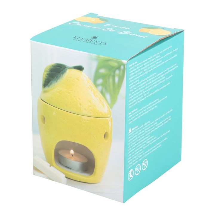 Yellow lemon-shaped candle wax warmer in a teal box for oil and wax