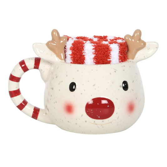 Ceramic mug shaped like a reindeer with a red and white striped hat on a white background