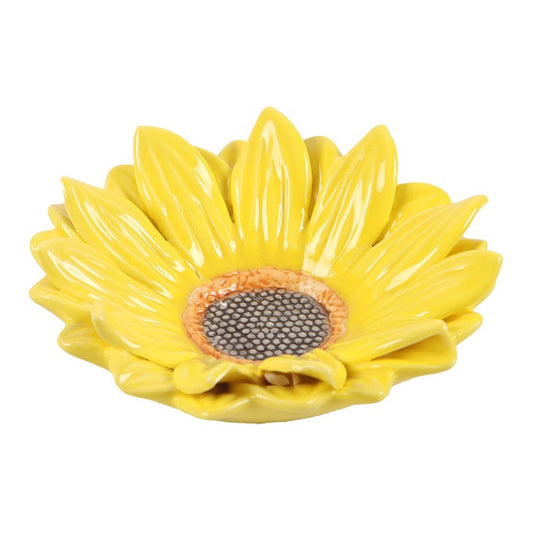 Yellow ceramic sunflower-shaped dish on a white background