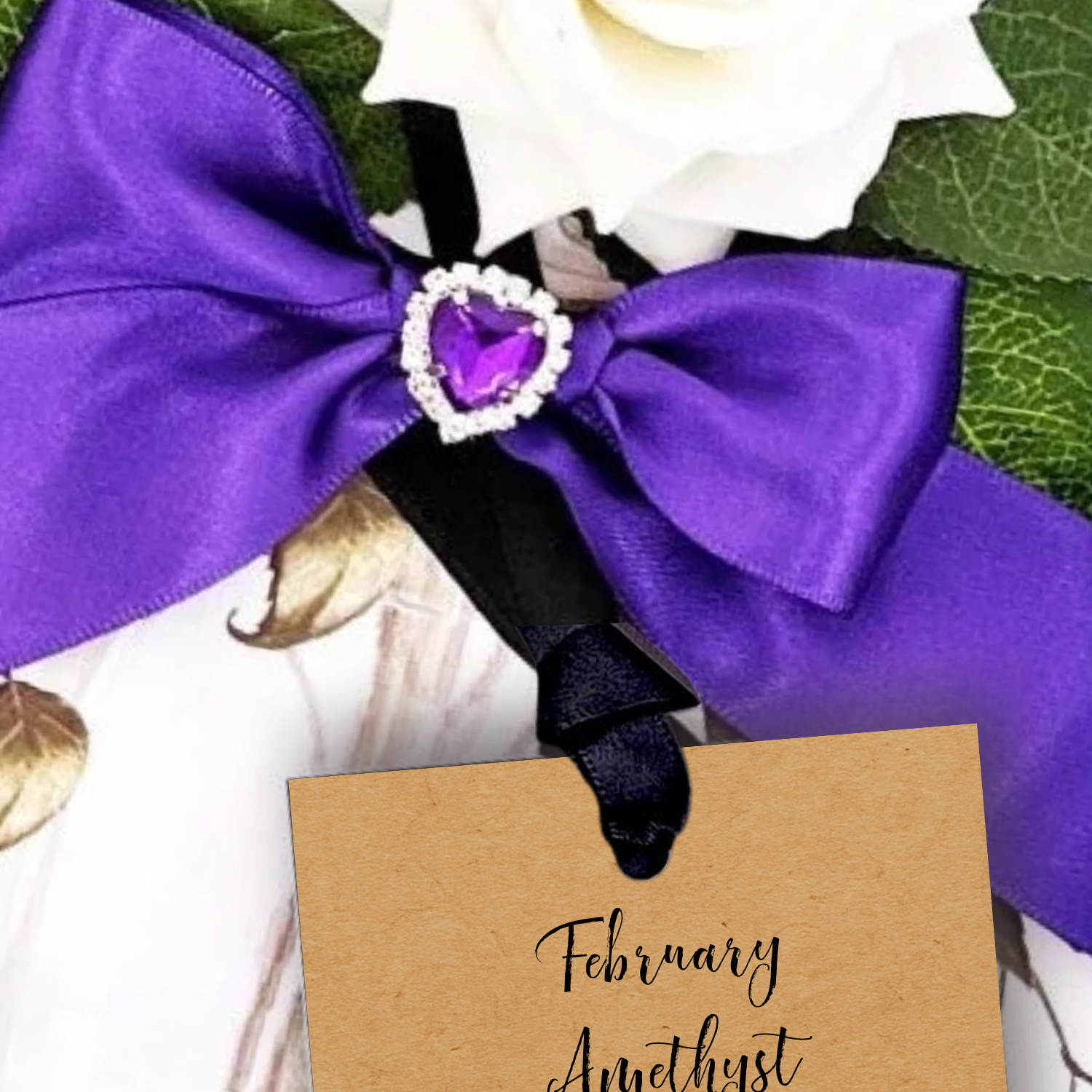 Luxury Amethyst February Birthstones + Flowers Gift Boxed Birthday Gift Card handmade with Purple bow with a heart-shaped amethyst stone on a floral background with a personalised card reading 'February Amethyst' but you choose your personalized wording online.