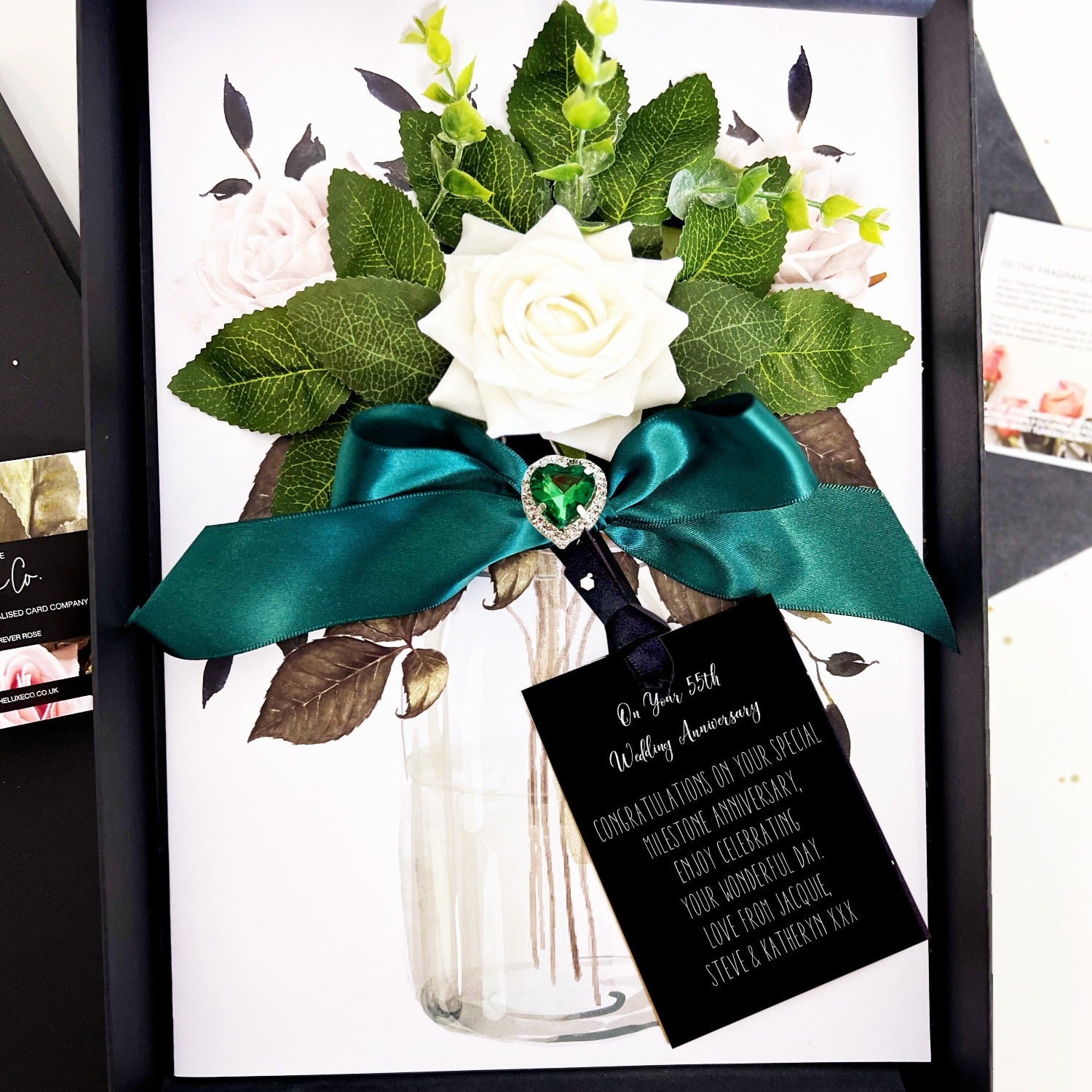 Luxury 55th Anniversary card with emerald crystal heart on scented bouquet