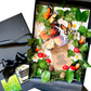 A decorative gift boxed cards containing a handmade butterfly and floral arrangement with green leaves, white daisies, orange and black butterflies, red berries, pinecones, and a kraft paper message card. A black ribbon and black gift box are also visible beside the arrangement.