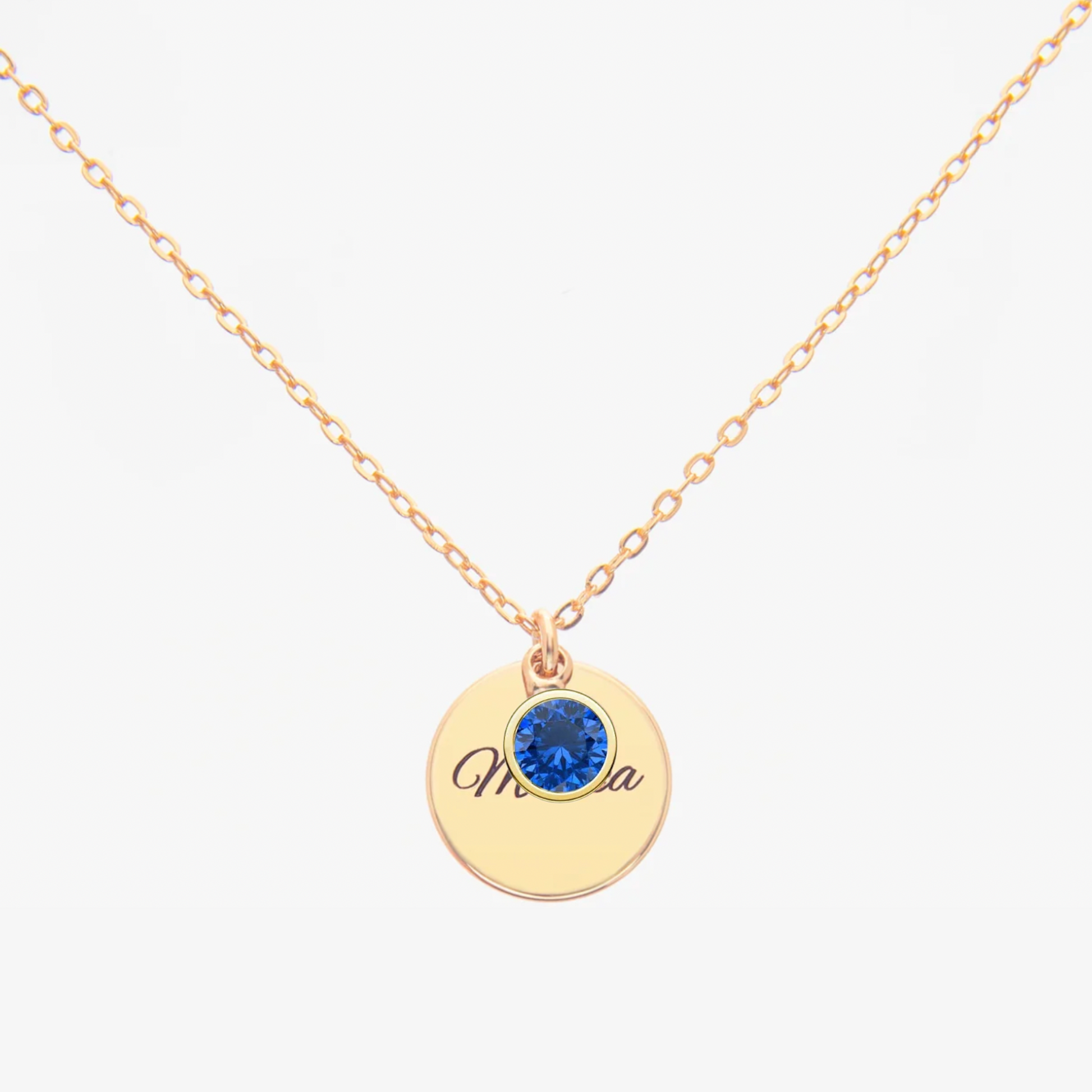 Gold Personalised Sapphire Birthstone necklace with a round pendant featuring a Sapphire (birthstone for September) and personalized engraved text on a white background