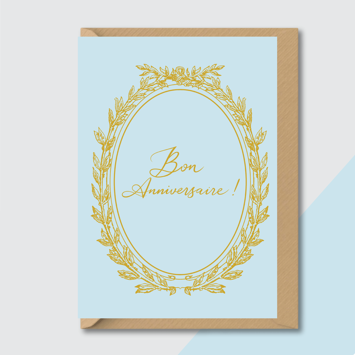 vintage birthday card bon anniversaire pastel blue gold elegant flat lay on contrasting background with envelope