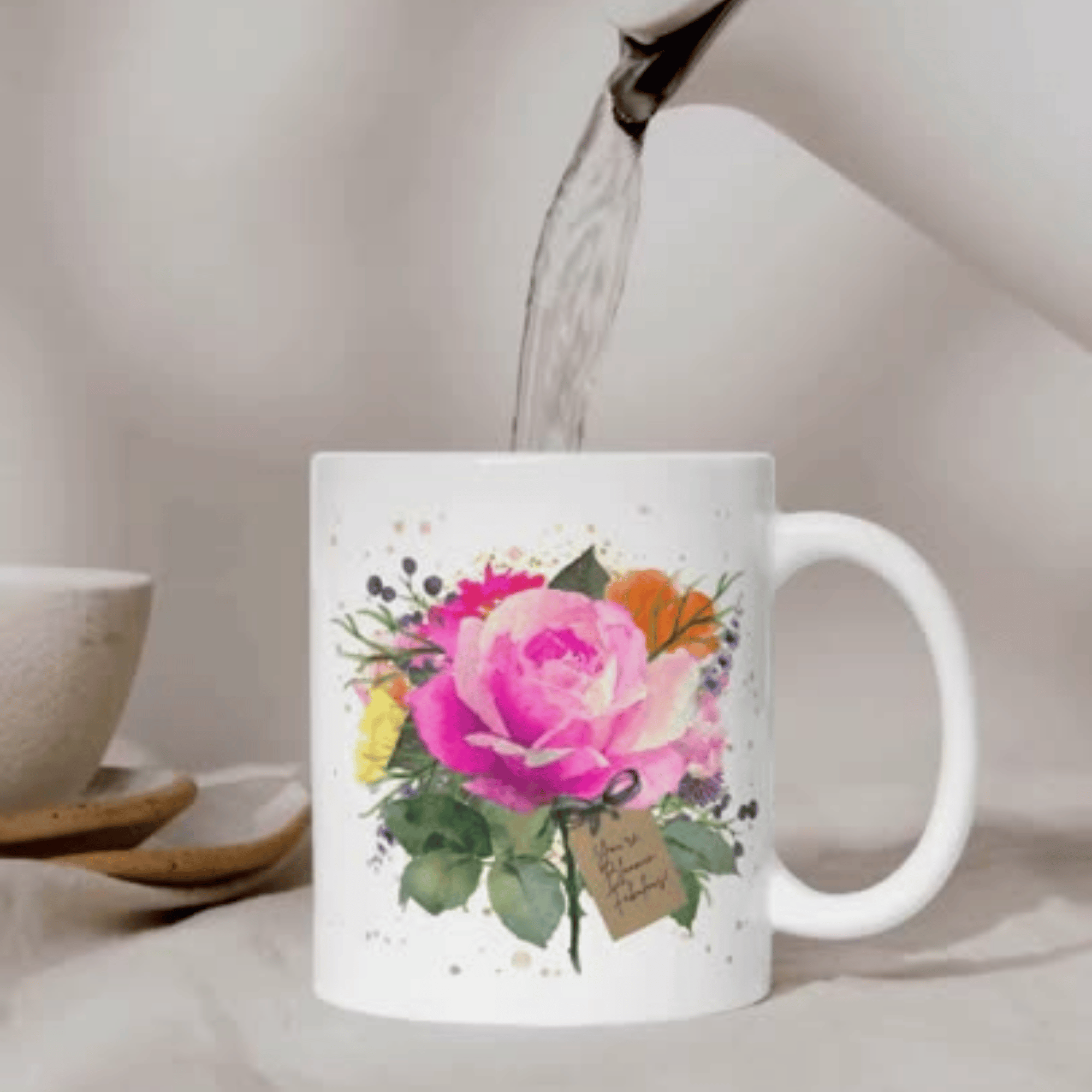 The Hot Pink Rose Bloom Mug - Makes a Beautiful Gift for someone who's Bloomin Fabulous! Features ceramic white mug with Lilly's beautiful watercolor floral artwork with a hot pink rose. Tag on mug reads ' You're Bloomin Fabulous' This mug is Available Personalised