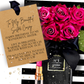 Luxury Sister Birthday Card handmade with a Bouquet of everlasting pink roses with a personalized card and makeup product on a black and white striped background.